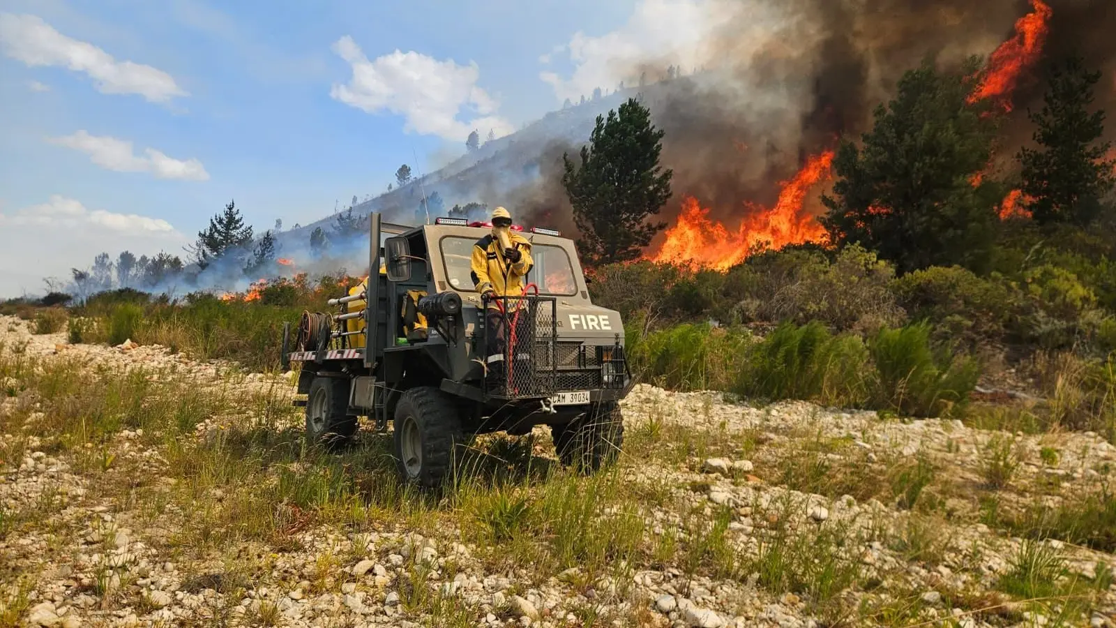 GVF Unimog operating beside an active vegetation fire