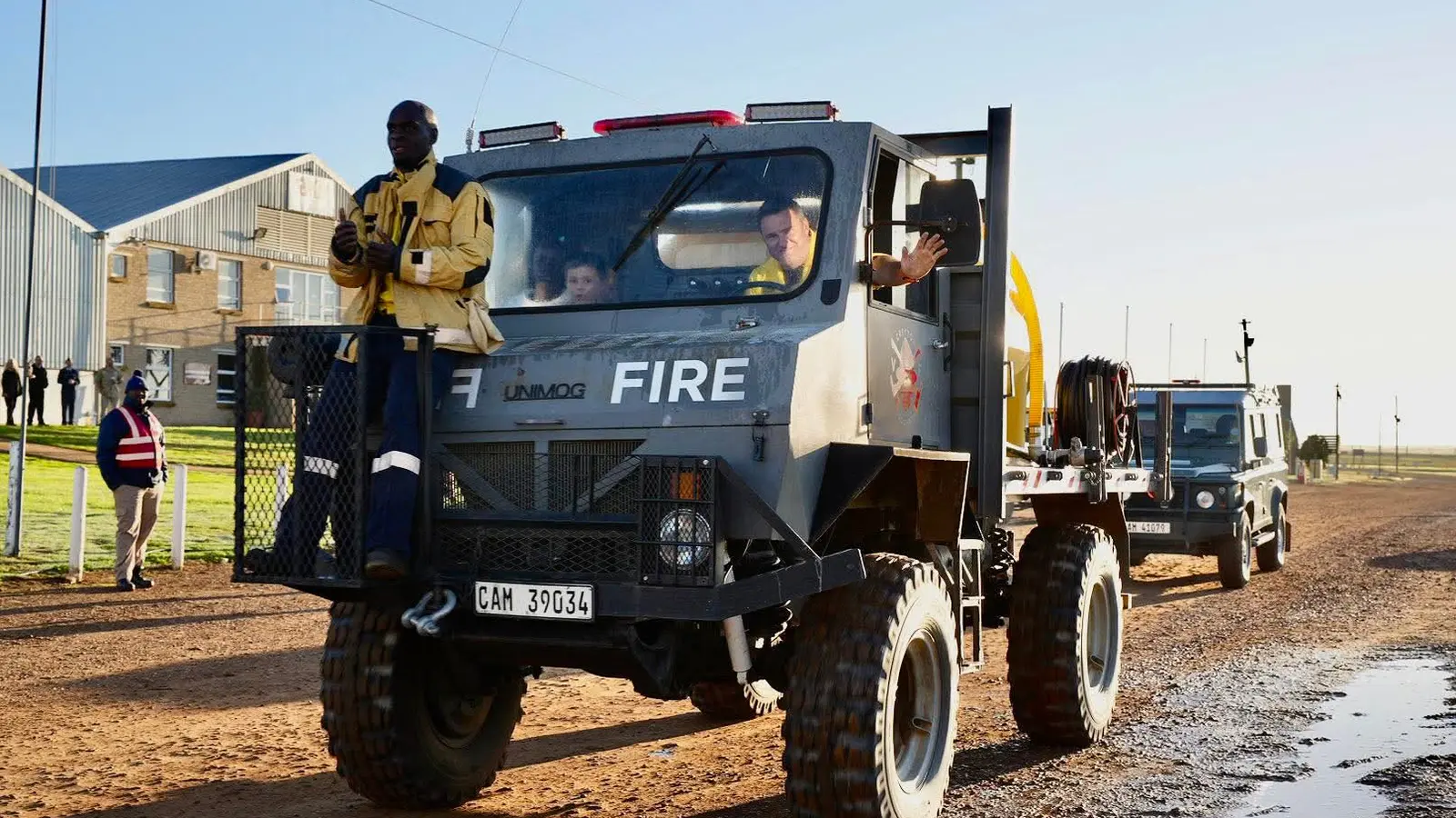 GVF volunteers standing on the Unimog
